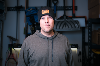 Man wearing a 'Cave Man' Beanie